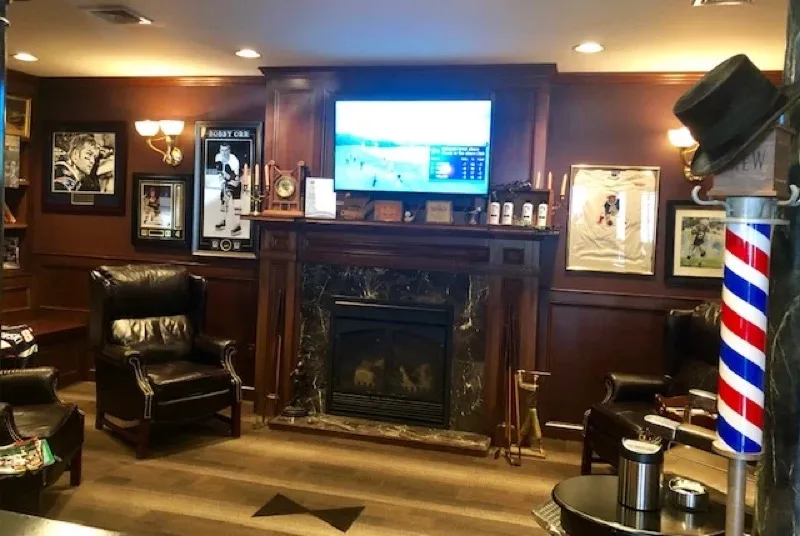 Reading lounge with leather chairs and bookshelves